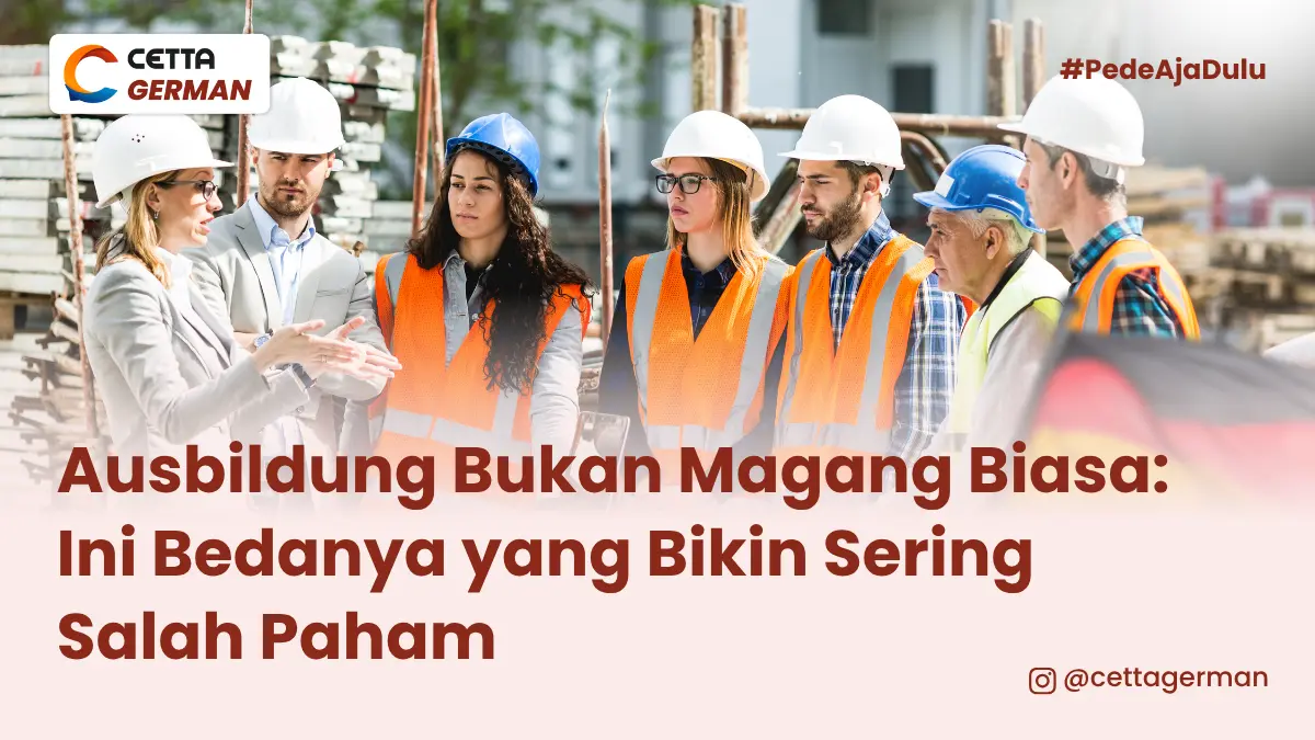sejumlah pekerja sedang berbincang sambil mengenalan pakaian safety